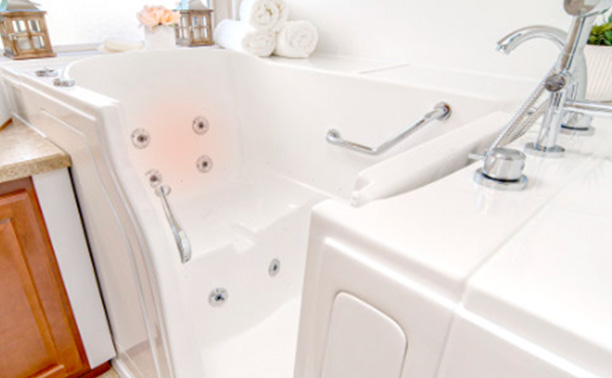 The image shows a bathroom with a white bathtub, a sink, and a faucet. There are no visible texts or distinguishing marks that provide additional context about the location or purpose of the bathroom.